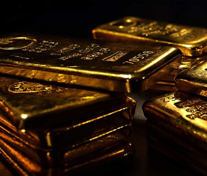 Gold and silver bars with falling prices