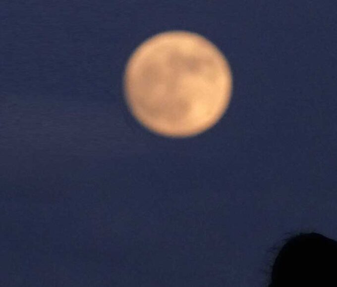 June Strawberry Moon rising at dusk