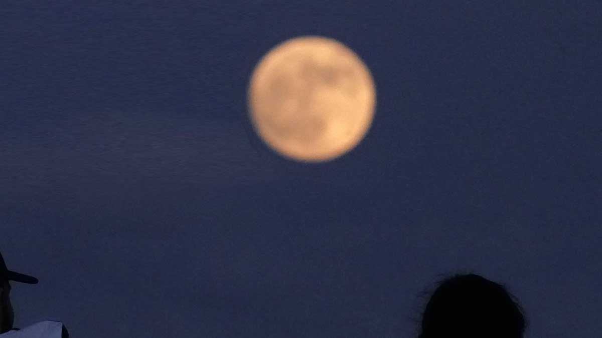 June Strawberry Moon rising at dusk