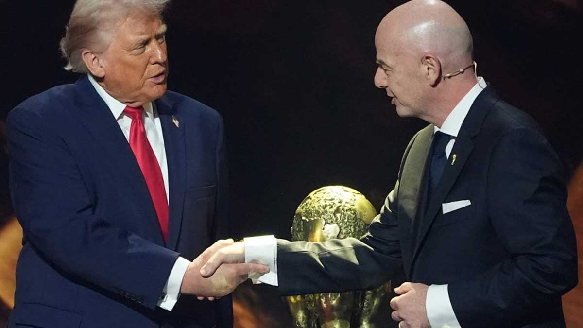 Trump and FIFA President Gianni Infantino beside World Cup trophy
