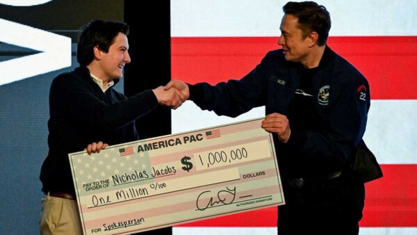 Elon Musk presents $1 million check