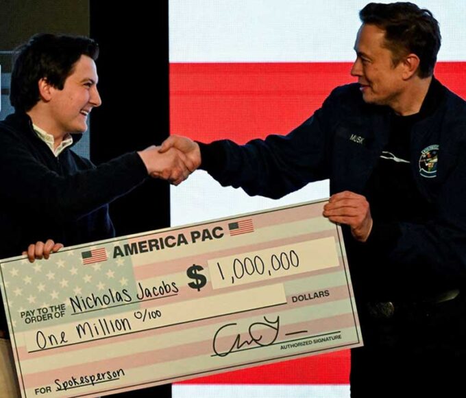 Elon Musk presents $1 million check