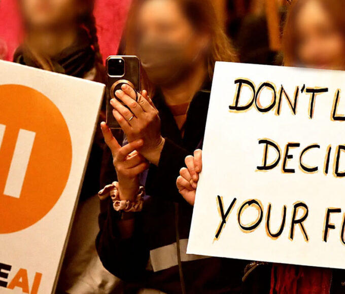 Young people protesting concerns about AI